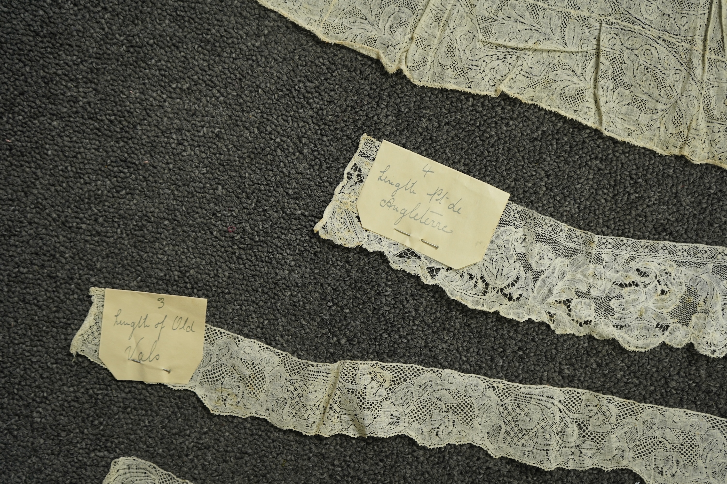 Various lengths of 18th and 19th century lace trimming and two needle run bonnets. Including a collar made from two rows of 18th century Valenciennes lace, a length Valenciennes lace, a shorter length of Pointe de Anglet